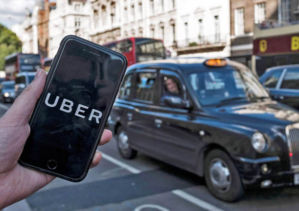 Uber dará salario mínimo y vacaciones pagadas a sus conductores británicos